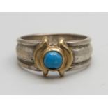 A silver, gold mounted and turquoise ring, stamped 585, 4.6g, O