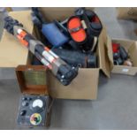 A collection of cameras and camera equipment including tripods, lenses and a moisture indicator **