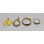 A 9ct gold ring, a small yellow metal ring, a yellow metal oriental pendant marked 999.9 and one