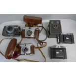 A collection of vintage cameras, including Yashica and Kodak