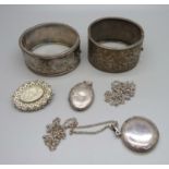 Two silver bangles, two silver lockets and a brooch lacking hook