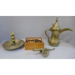 A boxed wooden chess set, a Persian brass tea pot, chamber stick and cannon, cannon a/f
