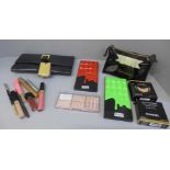 Assorted cosmetics including Chanel powder blush no. 99, YSL mascara volume effect waterproof,