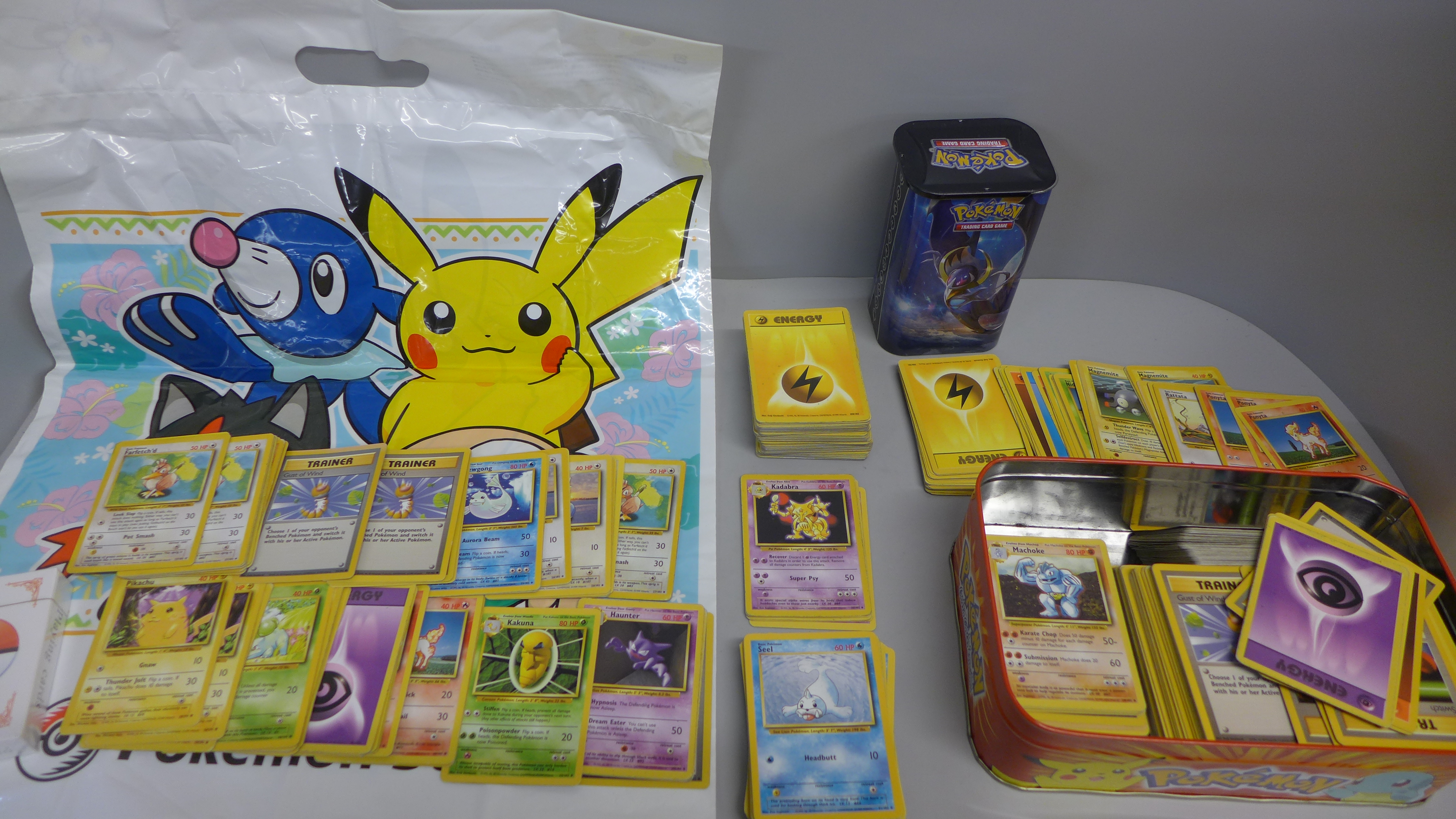 700 Pokemon base set cards including collector tins and book, etc.