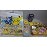 700 Pokemon base set cards including collector tins and book, etc.