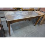 An early 20th Century oak kitchen table *Please note this lot is subject to VAT on top of the hammer