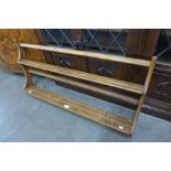 An Ercol elm wall rack