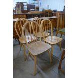 A set of four Ercol Blonde elm and beech Windsor chairs