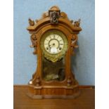 An American Ansonia Clock Co. beech shelf clock