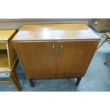 A teak two door record cabinet