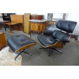 A Charles & Ray Eames style simulated rosewood and black vinyl revolving lounge chair and stool