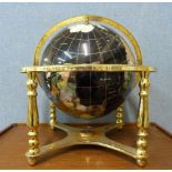 A gilt metal gemstone effect tabletop globe