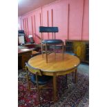 A G-Plan Fresco teak circular extending dining table and four chairs