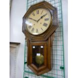 An early 20th century American Ansonia Clock Company carved oak wall clock