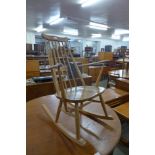 An Ercol Blonde elm and beech Goldsmith rocking chair