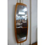 A teak framed mirror