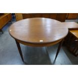 A G-Plan Fresco teak circular extending dining table