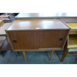 A teak two door record cabinet