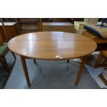 A Danish teak oval extending dining table