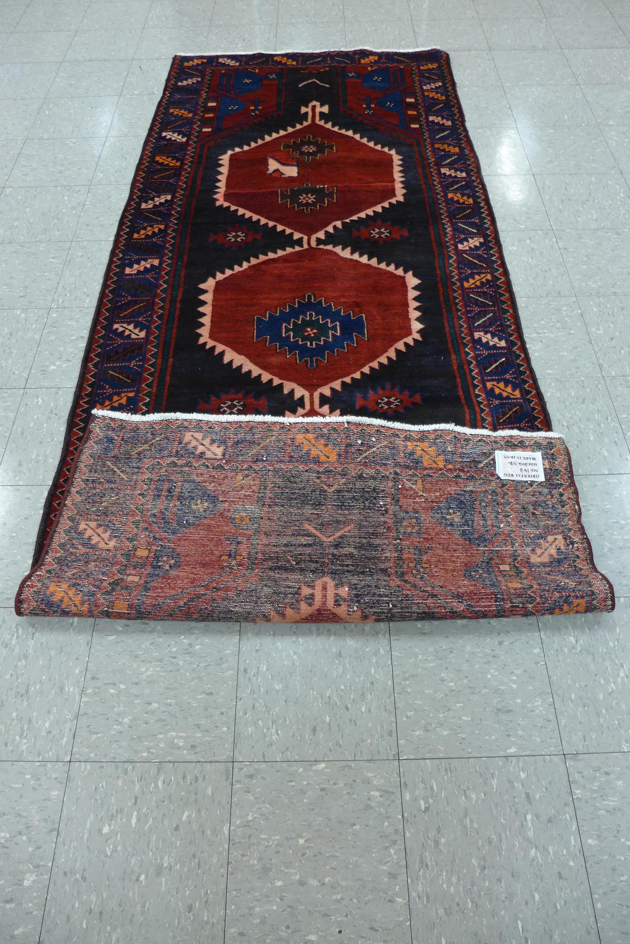 A Persian red ground Hamadan runner rug, 115 x 298cms - Image 2 of 2