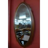 A teak framed mirror