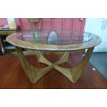 A G-Plan Astro teak and glass topped circular coffee table