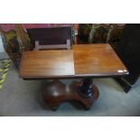 A Victorian mahogany adjustable double sided reading table