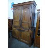 A 19th Century French oak and elm housekeepers cupboard