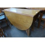 A teak drop leaf table