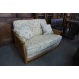 An Ercol Blonde ash settee