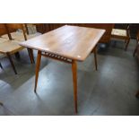 An Ercol elm and beech Windsor breakfast table