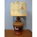 A glazed pottery table lamp