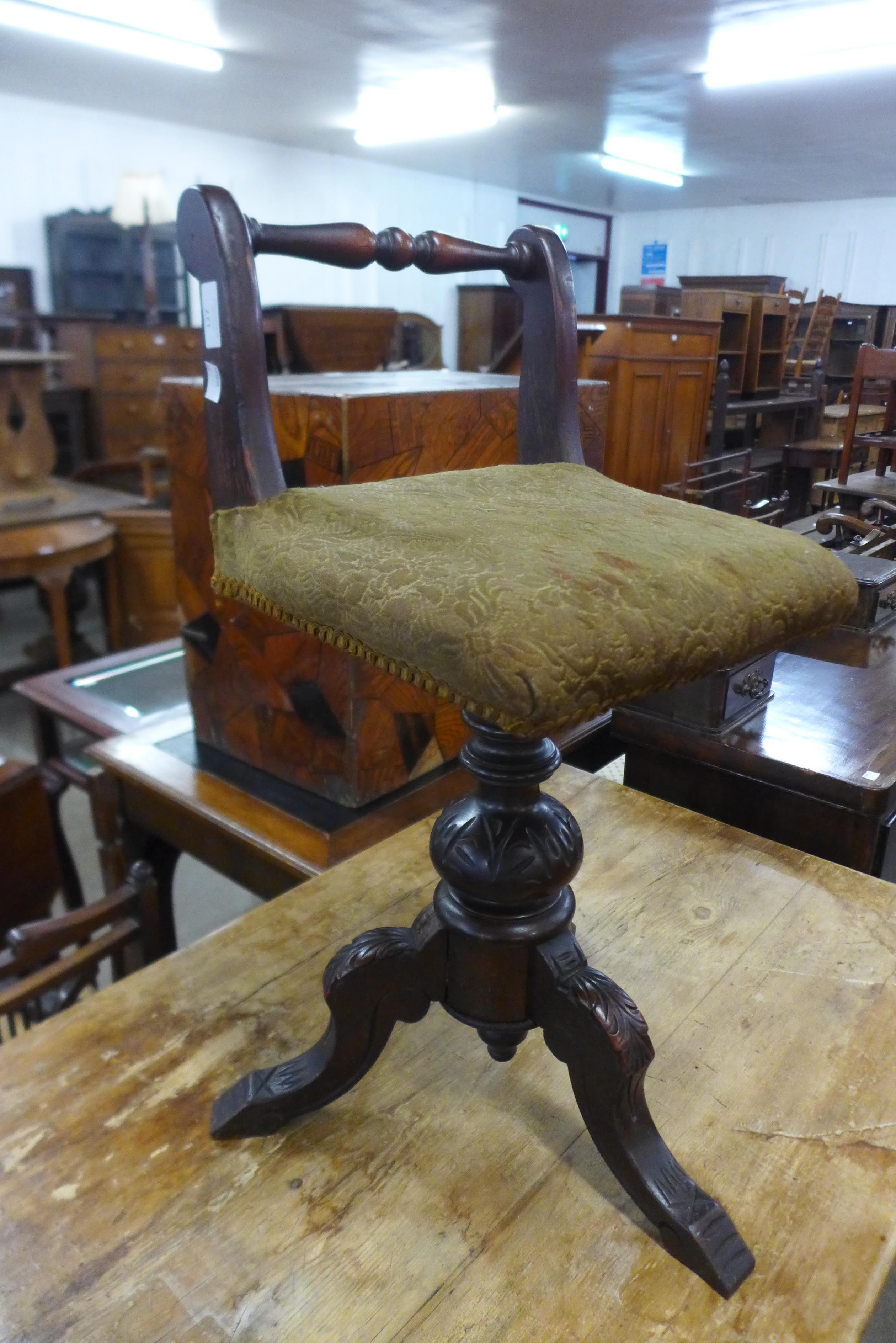 A Victorian mahogany revolving musician's stool