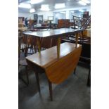 A Wrighton teak coffee table and a teak drop leaf table