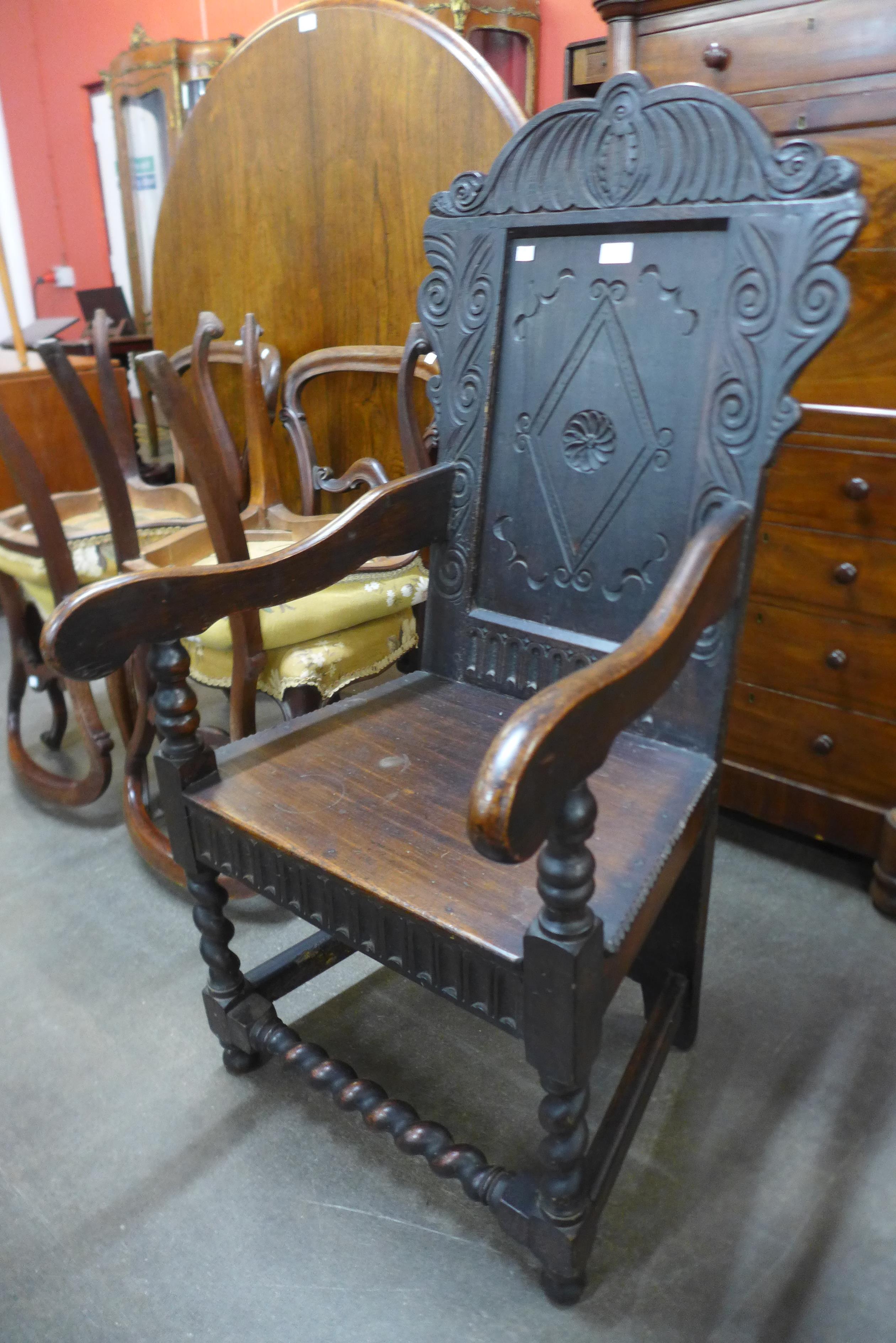 A 17th Century style carved oak Wainscot chair