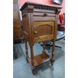 A Victorian Gothic Revival pitch pine pot cupboard