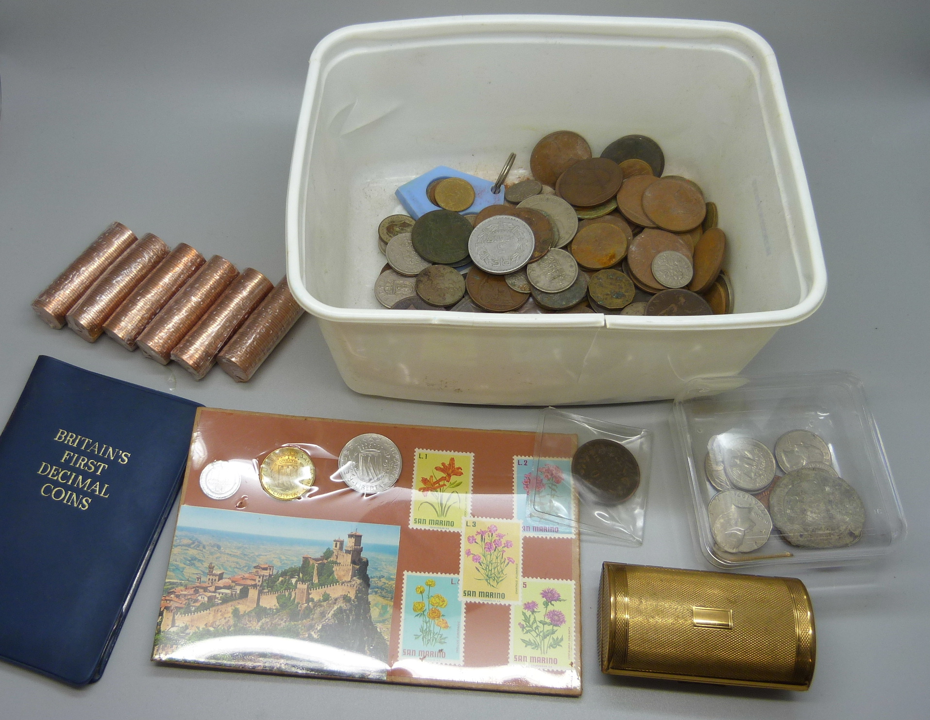 A box of mixed British and foreign coins