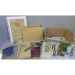 Militaria; a box of military issue items and other military related items including postcards