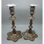 Two silver candlesticks, one marked London 1762, one marked London 1777, total weight 1079g