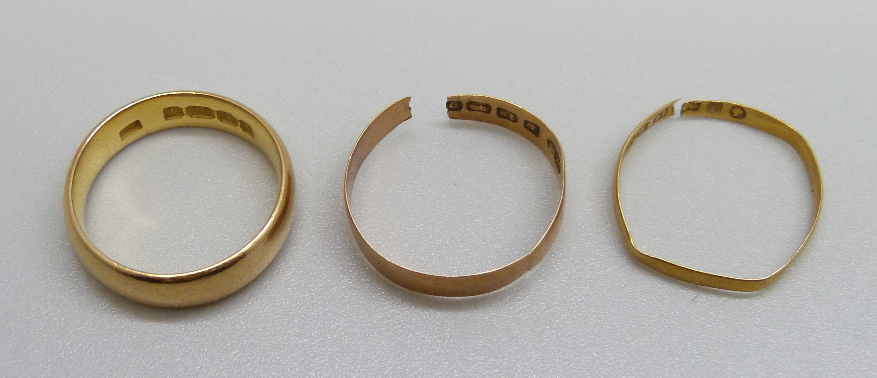 A 22ct gold wedding ring, 6g, M, one other 22ct gold ring, a/f, 0.8g, and an 18ct gold ring, a/f, - Image 2 of 2