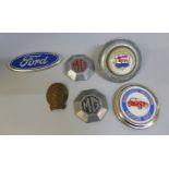 Six vintage car badges