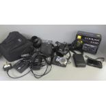 A collection of cameras and equipment including Nikon Coolpix S700, Nikon Coolpix S3100 and a