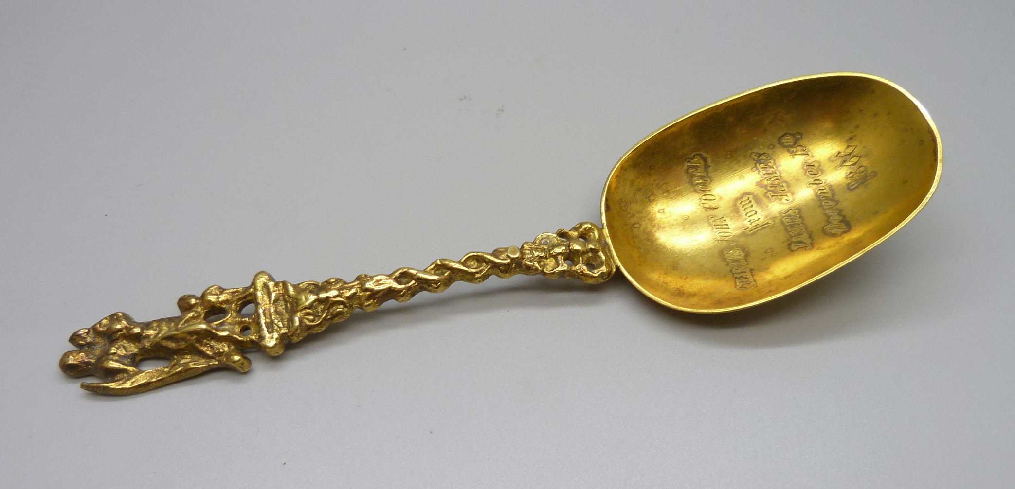 A gilt spoon bearing inscription dated 1866, 'Charles John Cooper from James James December 13th