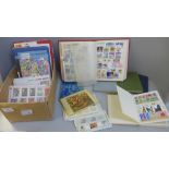 Stamps; a box of stamps in nine medium and small stock books and covers