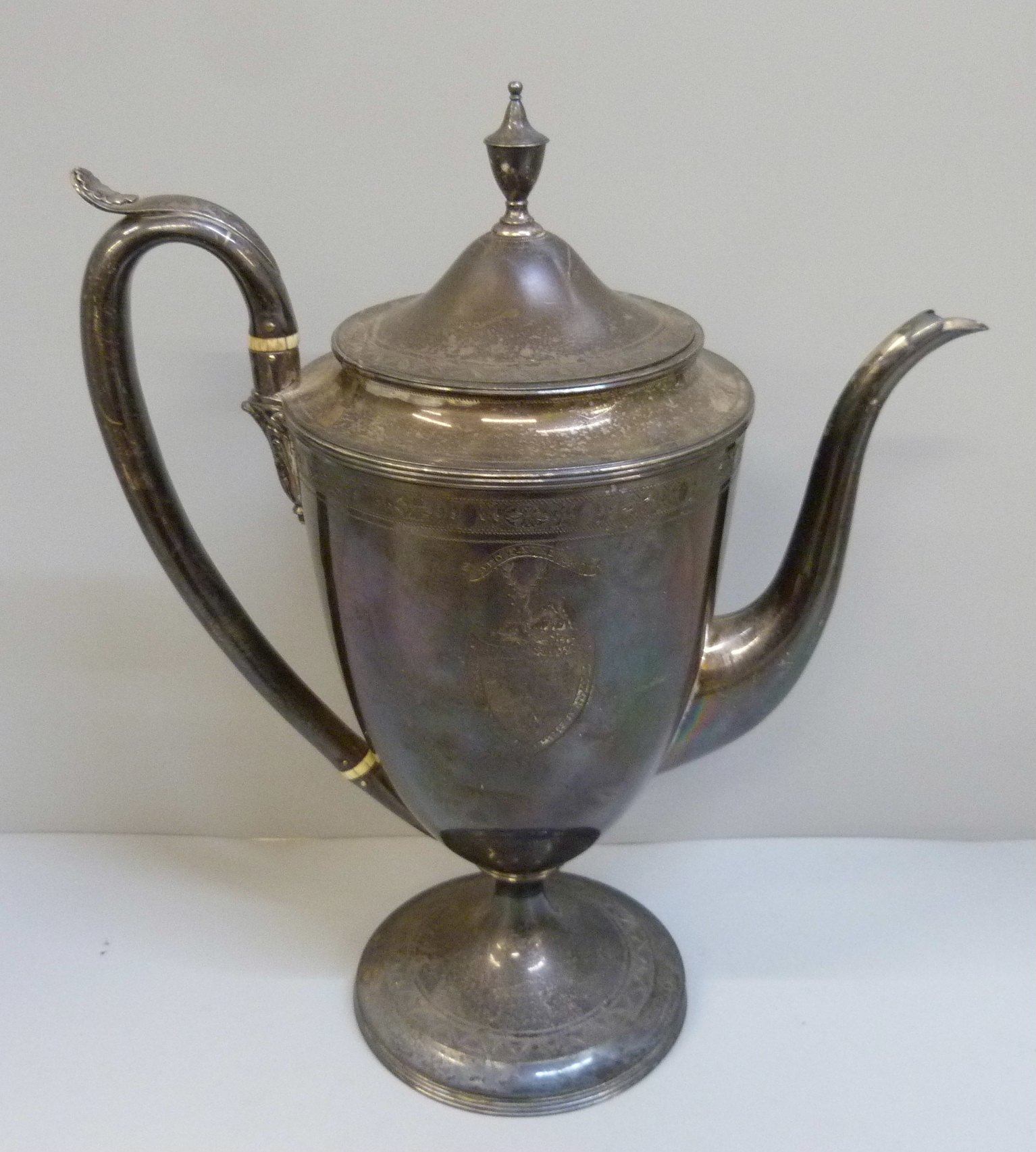 A George III silver coffee pot, London 1791, 1023g,