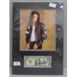 Michael Jackson autographed dollar bill display