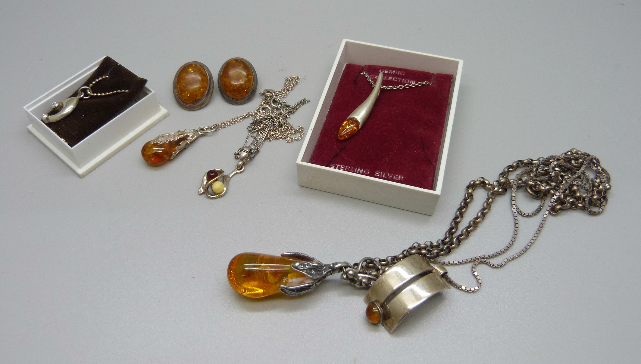 Silver and amber jewellery, six necklaces and a pair of earrings