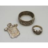 A silver ring, Moller, Trondhjem, P, a silver napkin ring and a late Victorian silver fob,