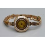 A lady's 9ct gold Rolex wristwatch on a 9ct gold expanding bracelet strap, London import mark for