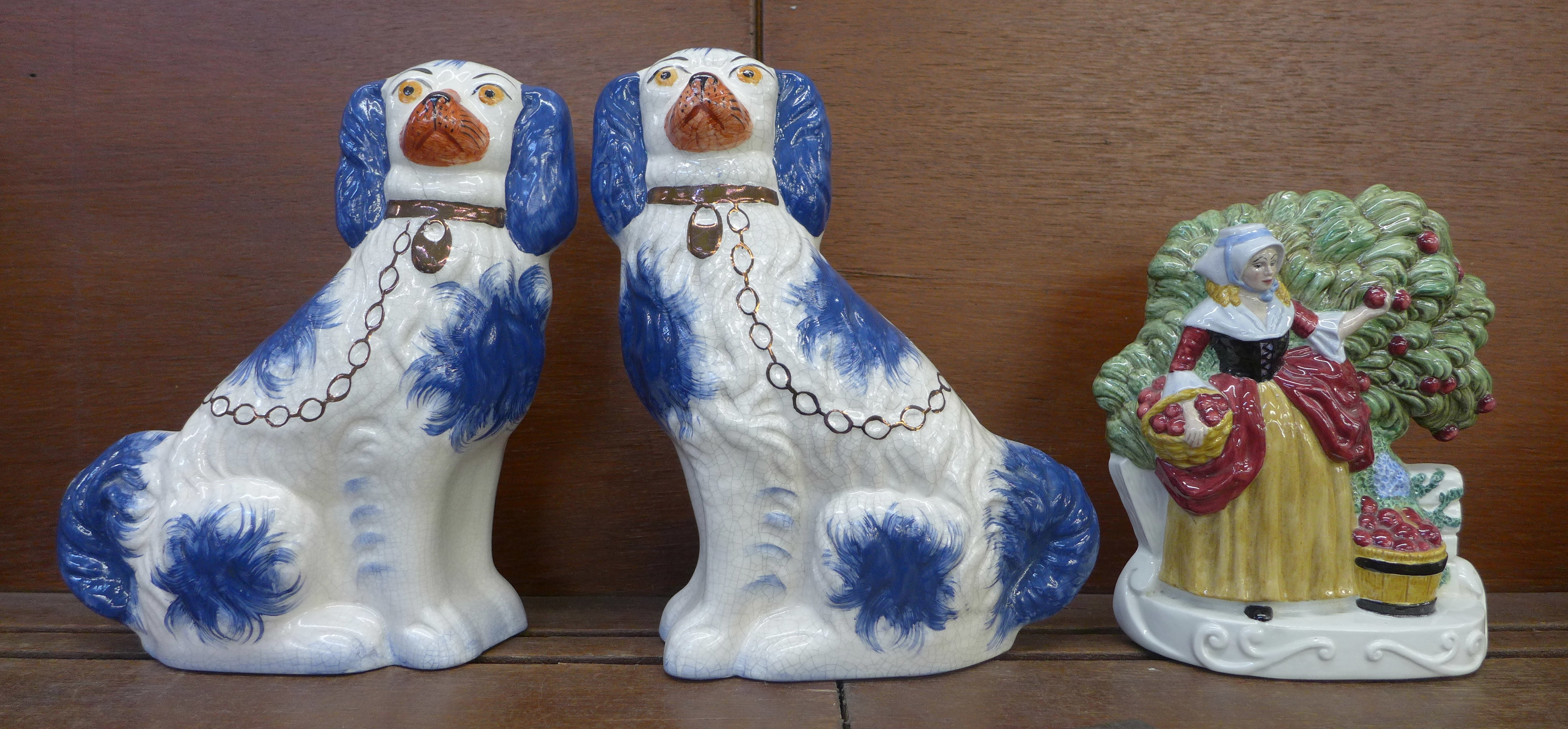 A pair of modern Staffordshire spaniels in blue colourway and a flatback figure